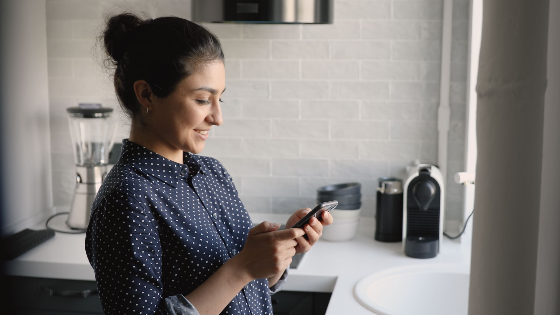 woman on her phone using Alight Worklife